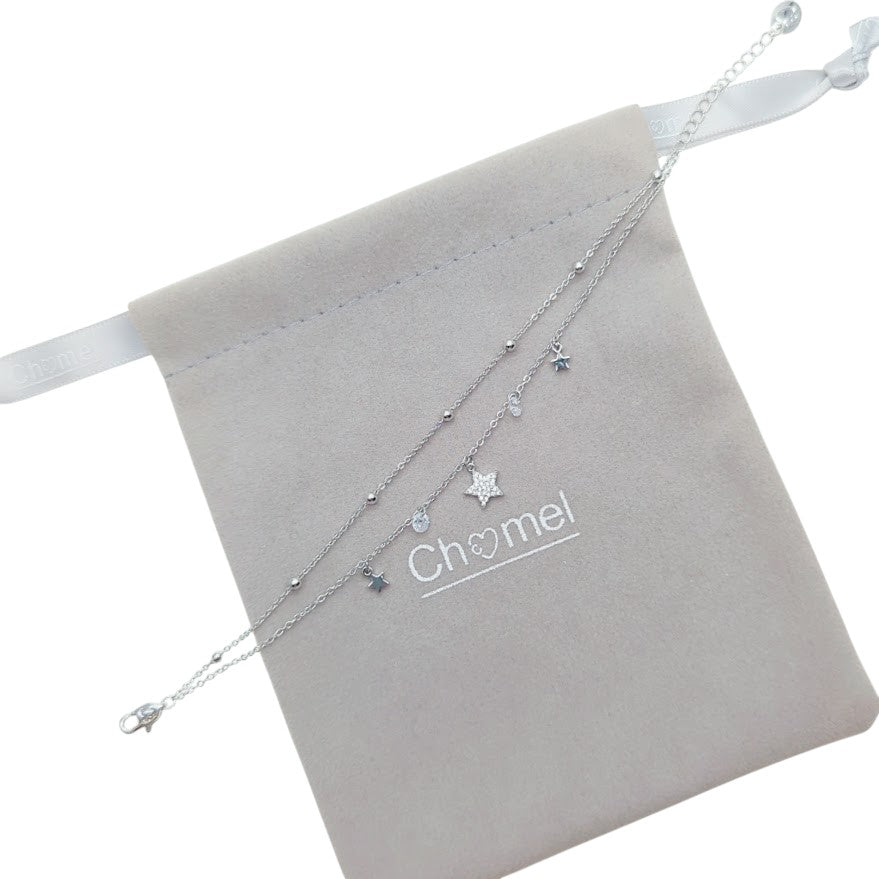 Planet Cubic Zirconia bracelet in silver-toned metal, featuring layered chains and dangling star charms.