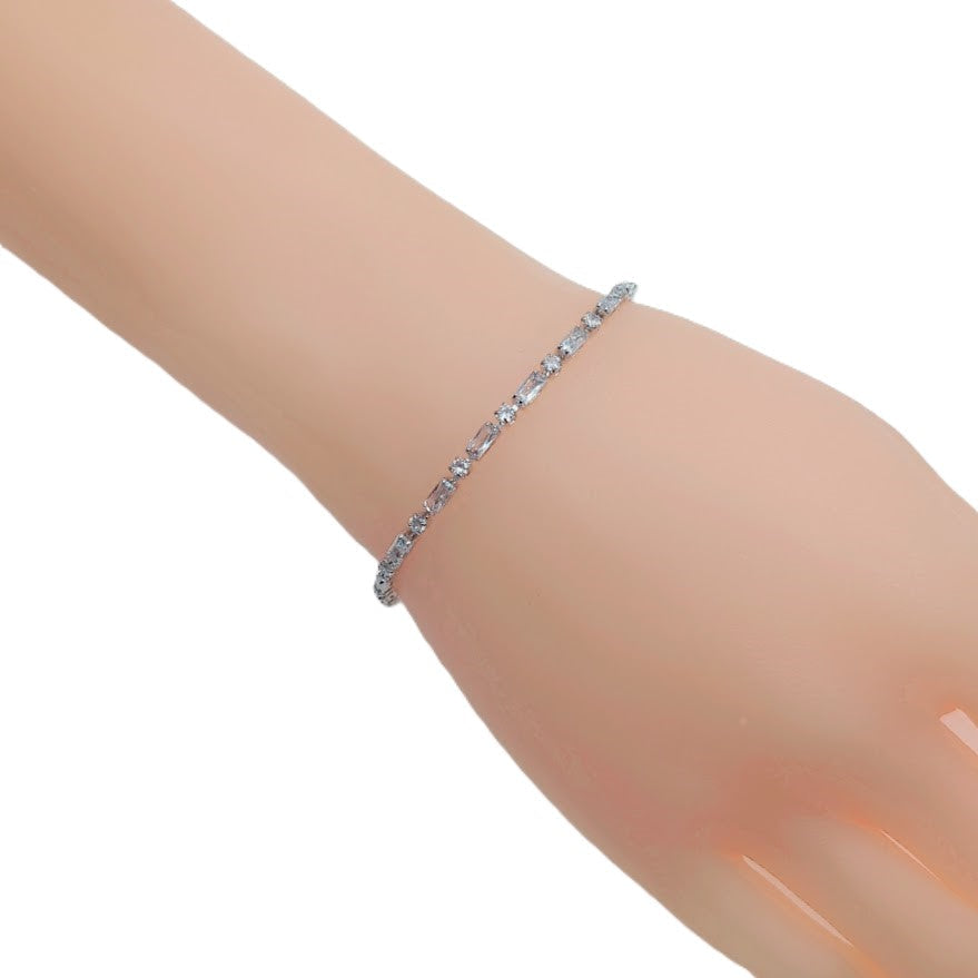 Cubic Zirconia Tennis Bracelet in silver-tone metal with a single row of sparkling baguette-cut stones
