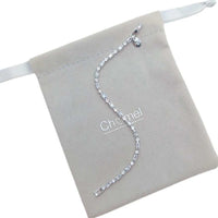 Cubic Zirconia Tennis Bracelet in silver-tone metal, featuring a single row of baguette-cut stones and clasp closure