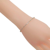 Cubic Zirconia Tennis Bracelet in a gold-toned finish, featuring a delicate row of sparkling baguette-cut stones