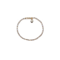 Cubic Zirconia Tennis Bracelet with a delicate gold-tone setting, clear sparkling stones, and heart charm detail