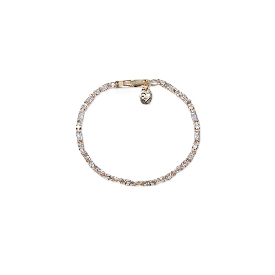 Cubic Zirconia Tennis Bracelet with a delicate gold-tone setting, clear sparkling stones, and heart charm detail