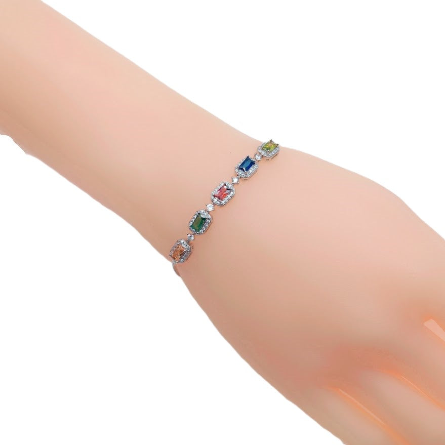Colourful cubic zirconia tennis bracelet with adjustable rhodium plated finish and rectangular stones