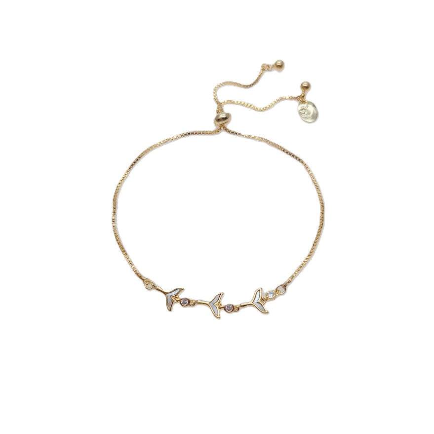 Cubic Zirconia Tennis Bracelet in gold-plated metal, featuring three mermaid-tail charms with sparkling stones and sliding adjuster