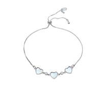 Cubic Zirconia Tennis Bracelet with three mother-of-pearl heart charms and sparkling stones, silver-tone sliding design