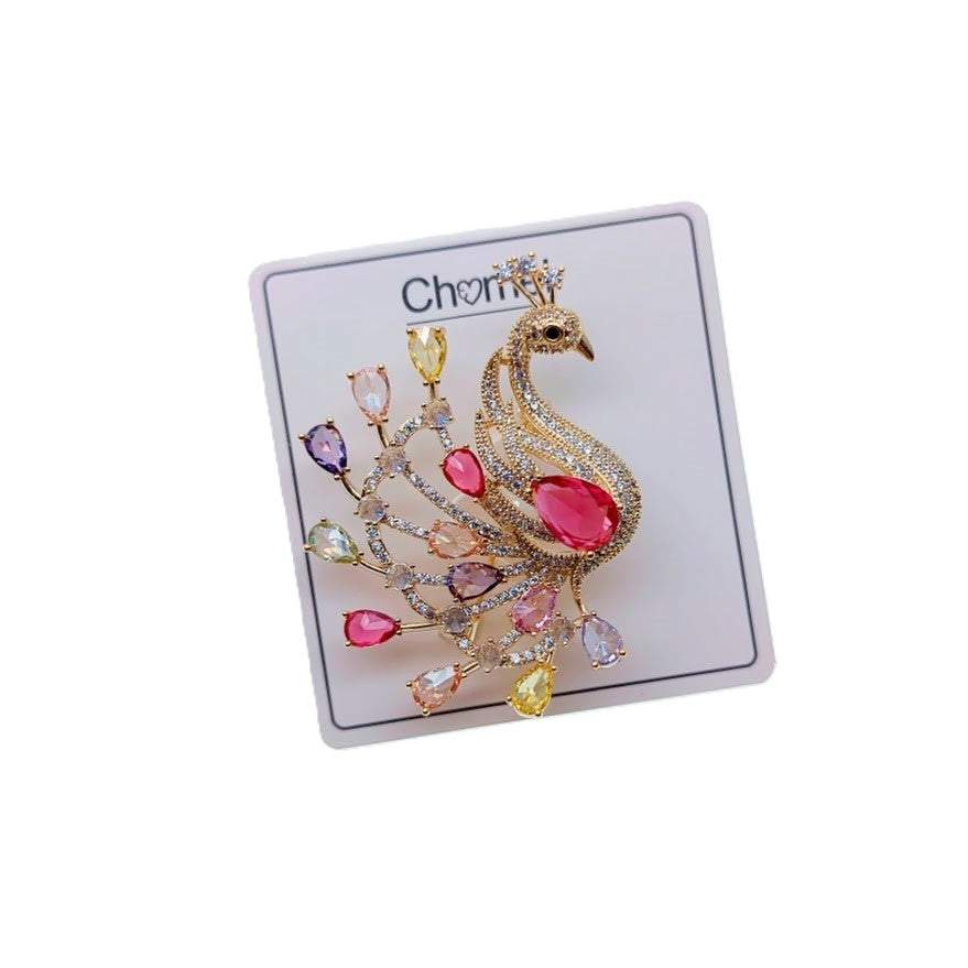Gold plated peacock brooch with colorful cubic zirconia stones and C clasp closure