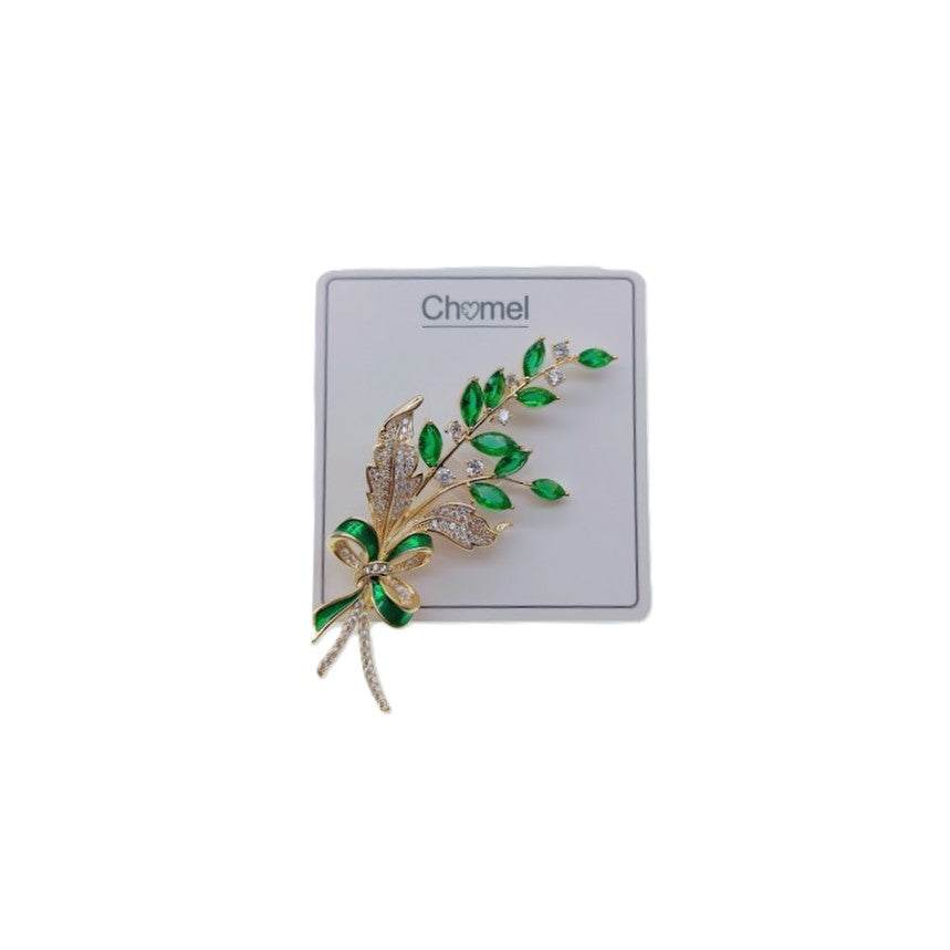 Gold plated leaf cubic zirconia brooch with green stones and C clasp closure