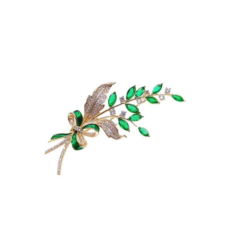 Gold plated leaf cubic zirconia brooch with green stones and C clasp closure