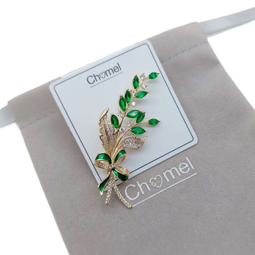 Gold plated leaf cubic zirconia brooch with green stones and C clasp closure