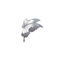 Silver-tone cubic zirconia brooch shaped as a half butterfly, with sparkling pavé wings and openwork details.