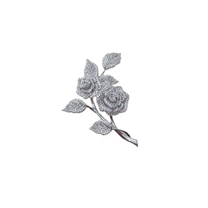 Cubic Zirconia Brooch in silver-tone rhodium-plated metal, featuring two sparkling rose blooms and textured leaves.