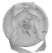 Cubic Zirconia Brooch with two silver-tone rose flowers and sparkling pavé leaves on a slender twisted stem.