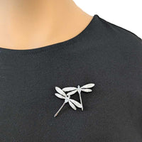 Elegant dragonfly cubic zirconia brooch with rhodium plating and intricate design