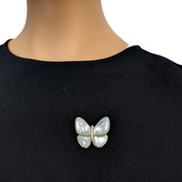 Butterfly Mother of Pearl Brooch with iridescent white inlay, gold-tone edging and a sparkling central accent.