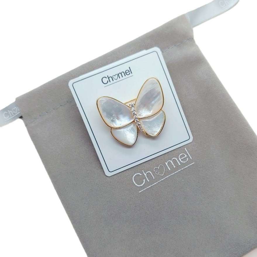 Mother of Pearl Brooch shaped like a butterfly, with iridescent shell wings, gold-tone edging and sparkling accents.