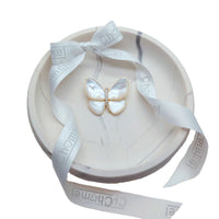 Butterfly Mother of Pearl Brooch with pearlescent white wings, gold-tone outline and sparkling crystal body, in a gift box.