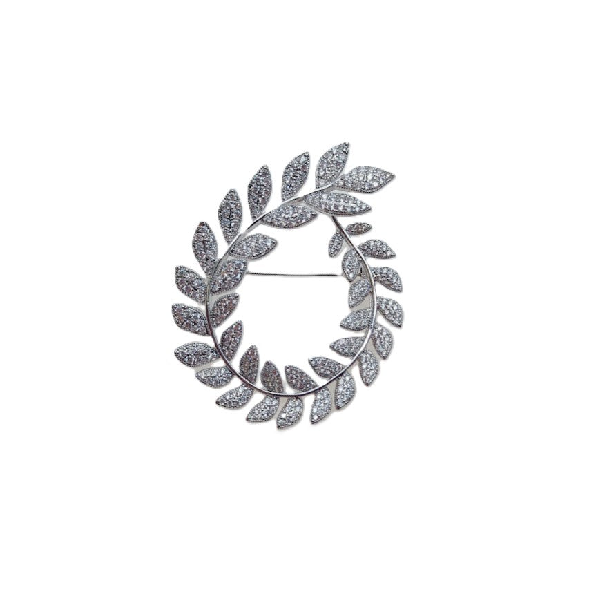 Cubic Zirconia Brooch in silver-tone metal, formed as an oval wreath of sparkling leaf-shaped stones with a pin fastening.