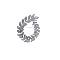 Cubic Zirconia Brooch in silver-tone metal, formed as an oval wreath of sparkling leaf-shaped stones with a pin fastening.