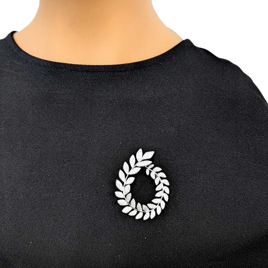 Cubic Zirconia Brooch in a silver-tone finish, featuring a sparkling oval wreath of leaf-shaped stones.