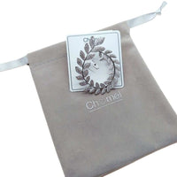 Cubic Zirconia Brooch in a silver-tone finish, shaped as an oval wreath of sparkling leaf details.