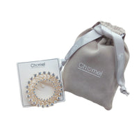 Gold plated round cubic zirconia brooch with baguette cut stones and C clasp closure, 4.5cm diameter