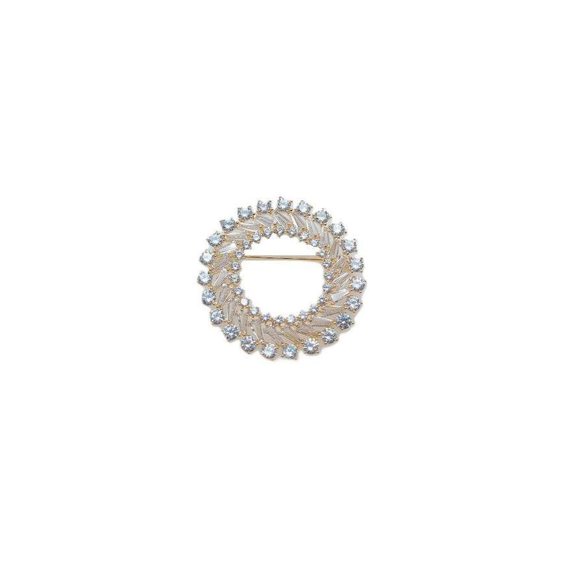 Gold plated round cubic zirconia brooch with baguette cut stones and C clasp closure