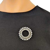 Gold plated round cubic zirconia brooch with baguette cuts and C clasp closure, 4.5cm diameter