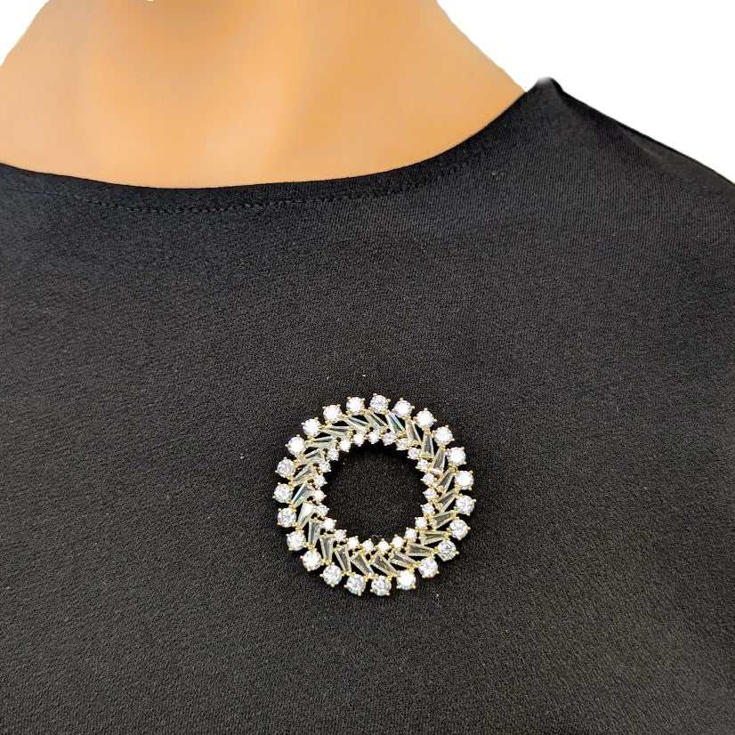 Gold plated round cubic zirconia brooch with baguette cuts and C clasp closure, 4.5cm diameter