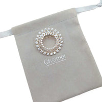 Gold plated round cubic zirconia brooch with round and baguette cut stones, 4.5cm diameter