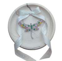 Dragonfly cubic zirconia brooch in silver-tone metal, with sparkling clear stones and colourful pastel accents on its wings.