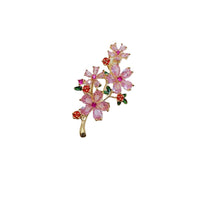 Cubic Zirconia Brooch with gold-tone branch, pink flowers, red rose accents and dark green leaves set with sparkling stones.