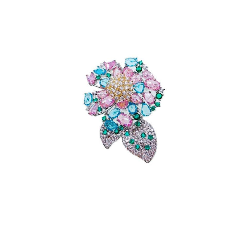 Flower cubic zirconia brooch with pastel pink and blue stones, green leaf accents, rhodium plated, 3.6x5cm size
