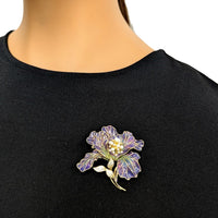 Flower Cubic Zirconia Brooch in purple and gold-tone metal, with translucent enamel petals, sparkling stones and a leafy stem.