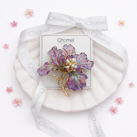 Cubic Zirconia Brooch with purple enamel flower petals, gold-tone stems and a sparkling pearl-and-stone centre.