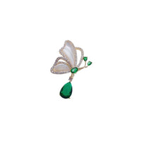 Gold plated butterfly cubic zirconia brooch with mother of pearl and dangling green teardrop stone