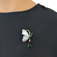 Butterfly cubic zirconia brooch with mother of pearl and dangling green teardrop stone, gold plated finish