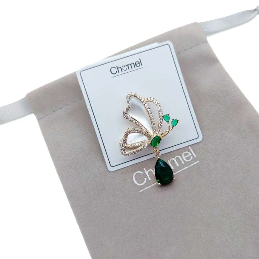 Gold-plated butterfly cubic zirconia brooch with mother of pearl and dangling green teardrop stone