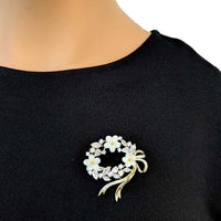 Gold plated oval flower wreath cubic zirconia brooch with ribbon and moonstone flowers
