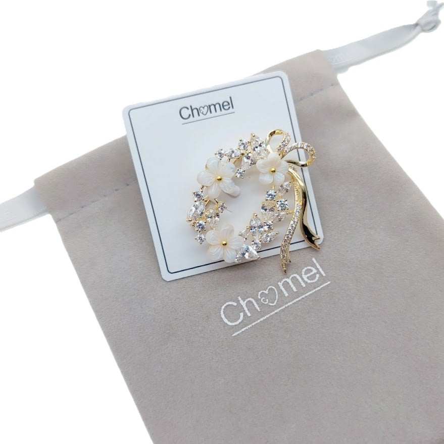 Gold plated oval flower cubic zirconia brooch with ribbon detail and moonstone flowers