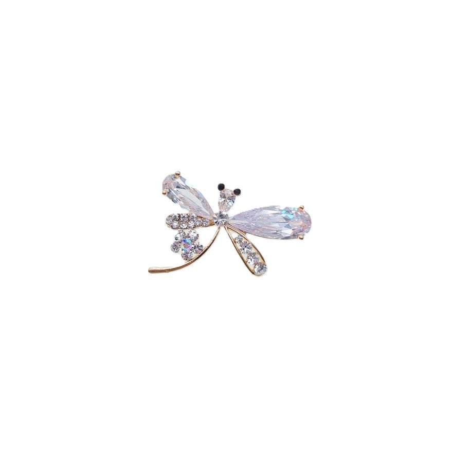 Gold plated dragonfly cubic zirconia brooch with single flower accent and C clasp closure