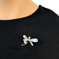 Gold plated dragonfly cubic zirconia brooch with single flower accent and C clasp closure