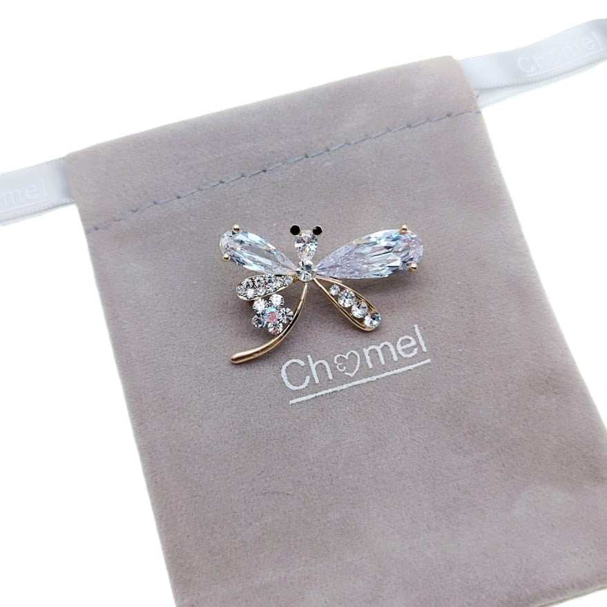 Gold plated dragonfly cubic zirconia brooch with single flower and C clasp closure