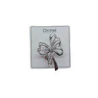 Elegant rhodium plated ribbon cubic zirconia brooch with fluid design and C clasp closure