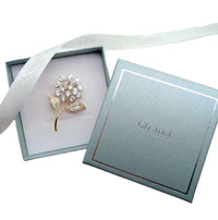 Gold plated leaf cubic zirconia brooch with flower stalk design and C clasp closure