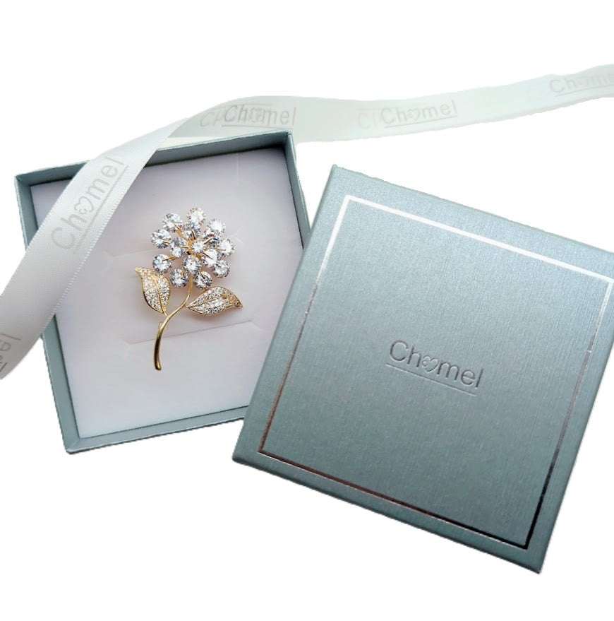 Gold plated leaf cubic zirconia brooch with flower stalk design and C clasp closure
