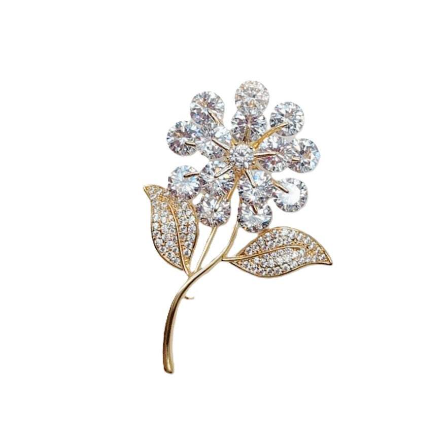 Gold-plated flower and leaf cubic zirconia brooch with C clasp closure