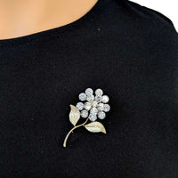 Gold-plated leaf cubic zirconia brooch with flower stalk design and C clasp closure