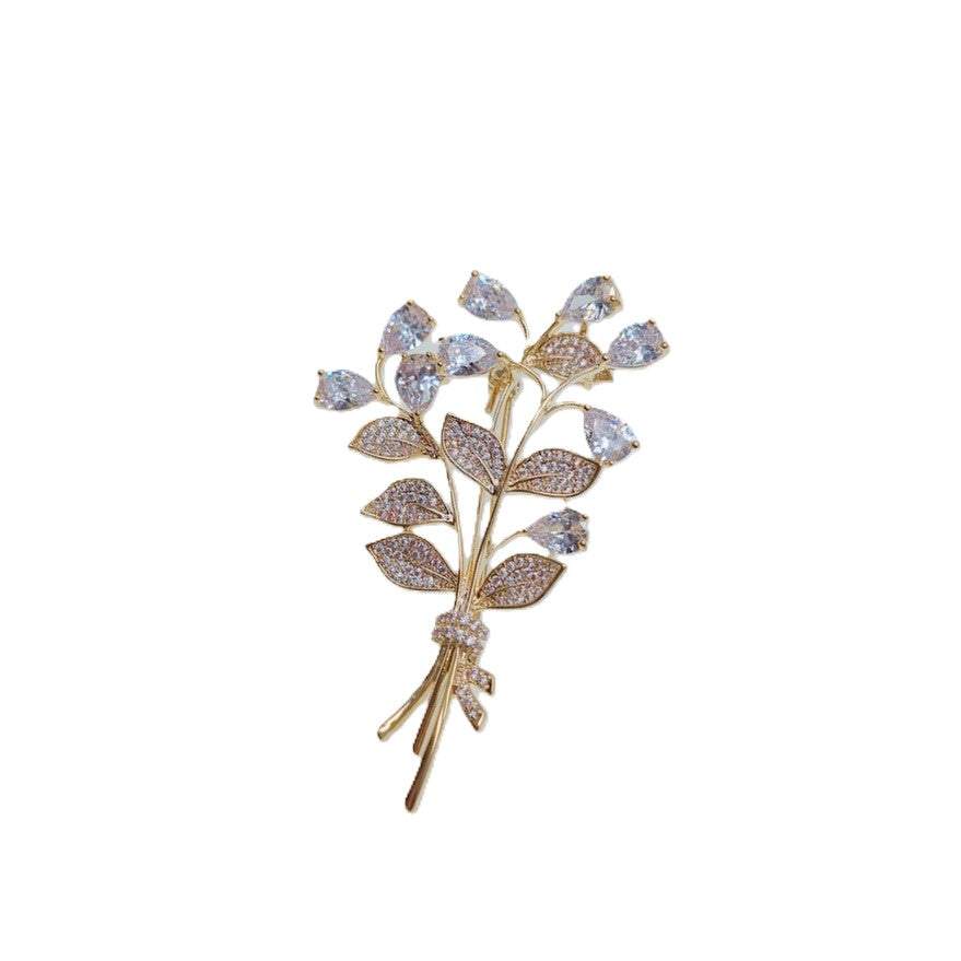 Gold-plated leaf cubic zirconia brooch with bouquet design and C clasp closure, 3.9cm by 6cm