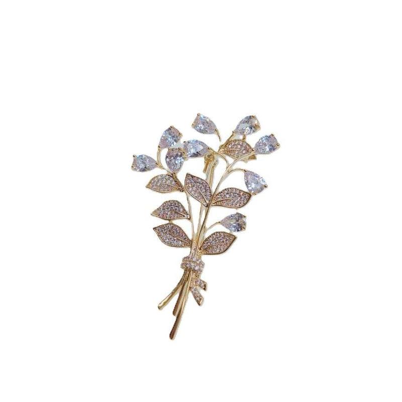 Gold-plated leaf cubic zirconia brooch with bouquet design and C clasp closure, 3.9cm by 6cm