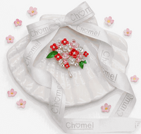 Cubic Zirconia Brooch with a bouquet of red and pink enamel flowers, clear sparkling stones, green leaves and gold-tone pin.